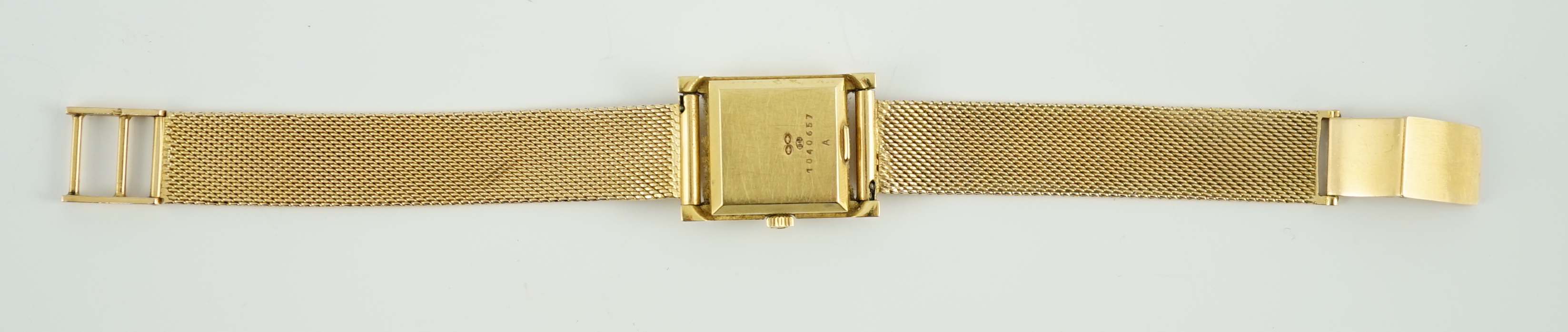 A lady's 18ct gold Jaeger LeCoultre Voguematic automatic rectangular wrist watch, on an associated Middle Eastern gold mesh link bracelet